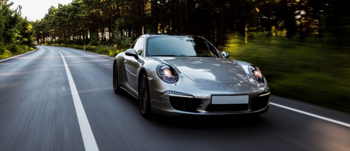 mini-coupe-high-speed-drive-road-with-front-lights